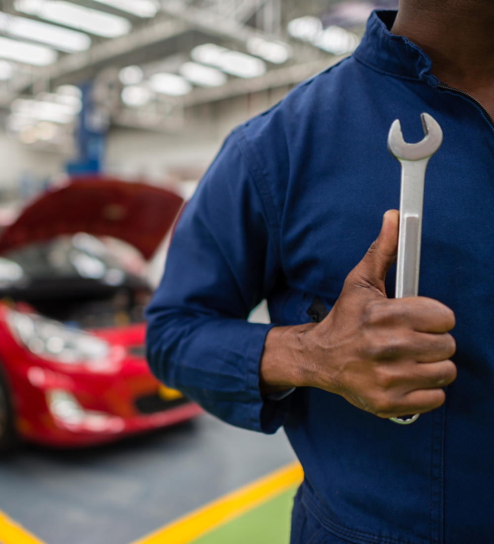 1 Mechanic with repair tool in hand